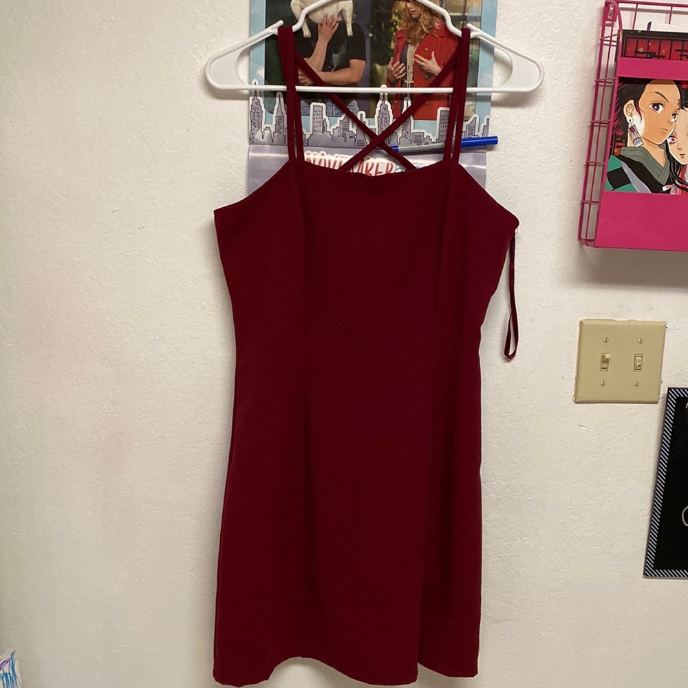 A Red Cross strapped dress. Never worn!! NWOT!! Length ends at knees!!